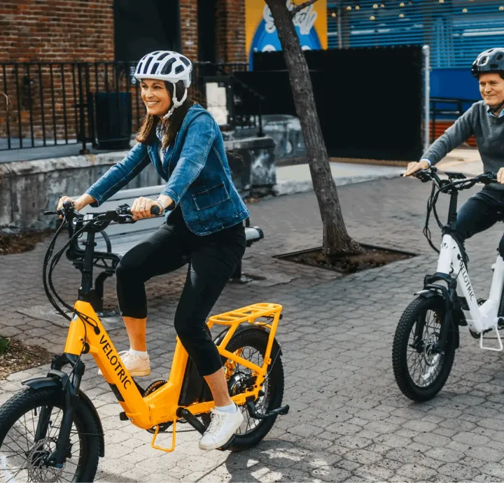 Two riders on Velotric e-bikes